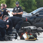 emergency crews work on a patient